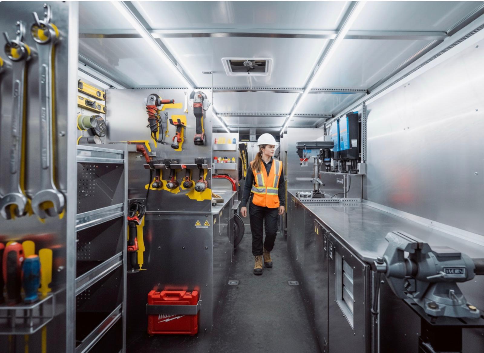 Water utility crew working inside a Gamotech workstation trailer