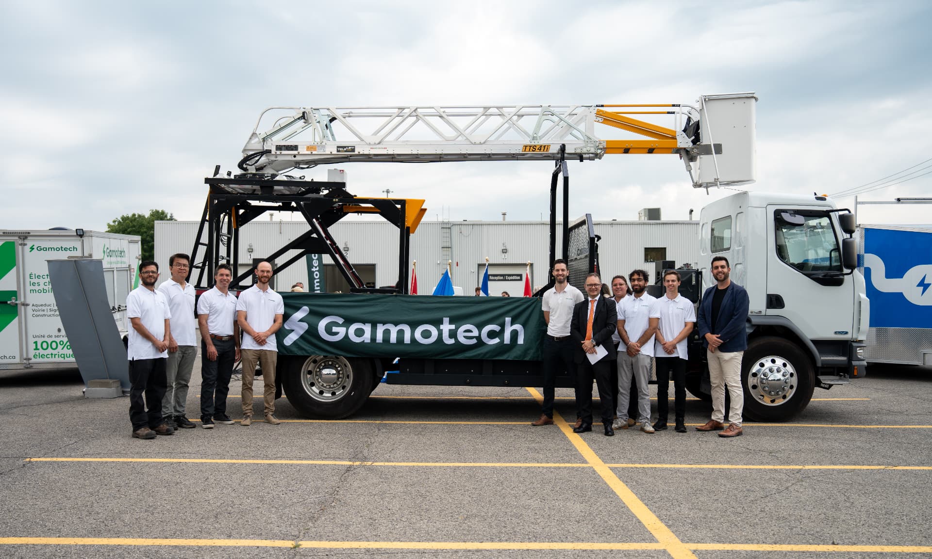 The Gamotech team in front of an electrified bucket truck